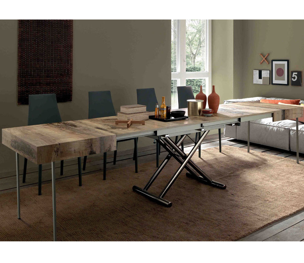 Table basse Assista relevable en position haute et extensible montrant les rallonges déployées