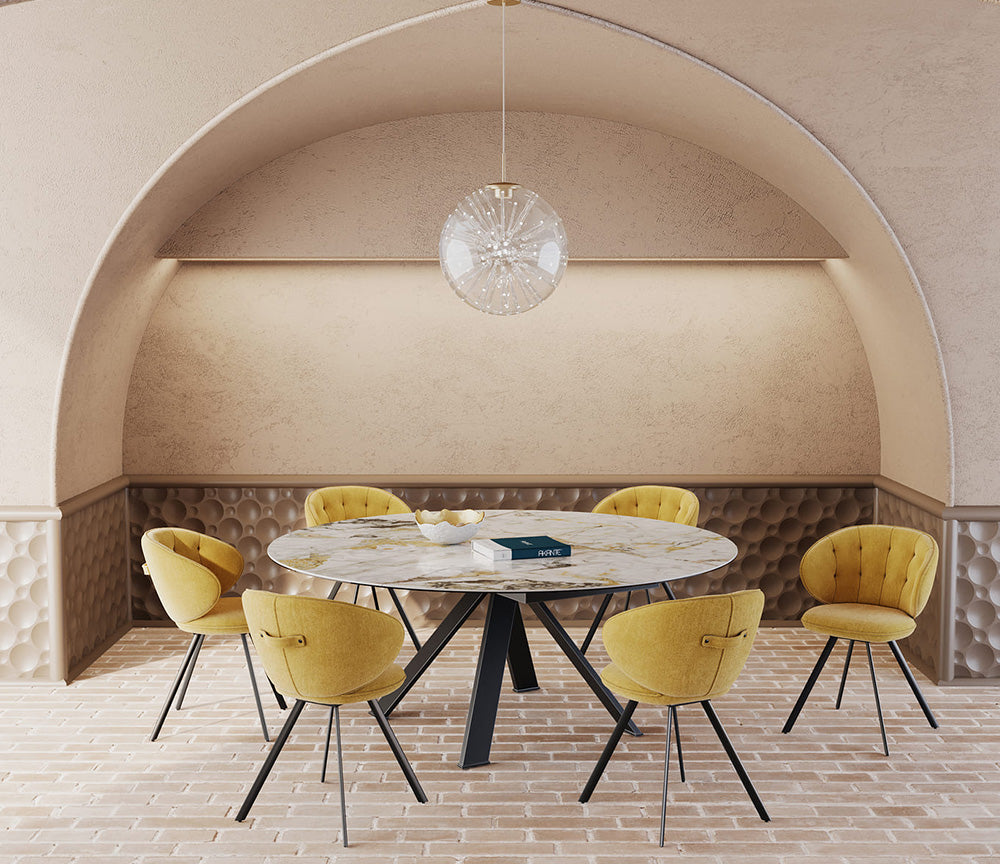 Table ronde céramique extensible marbre doro pieds métal noir dans une salle à manger