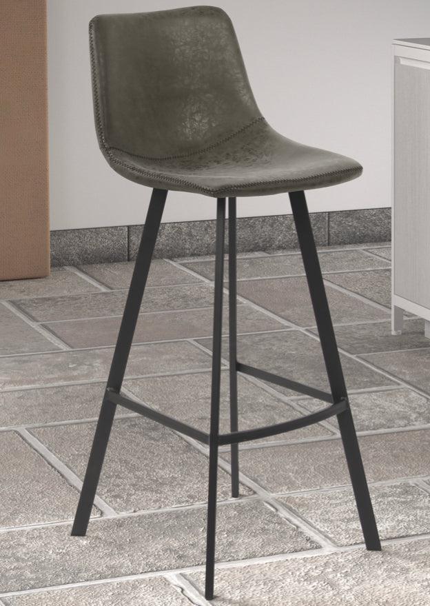 Tabouret de bar industriel pieds métal gris sur un carrelage gris clair - SOUFFLE d'intérieur