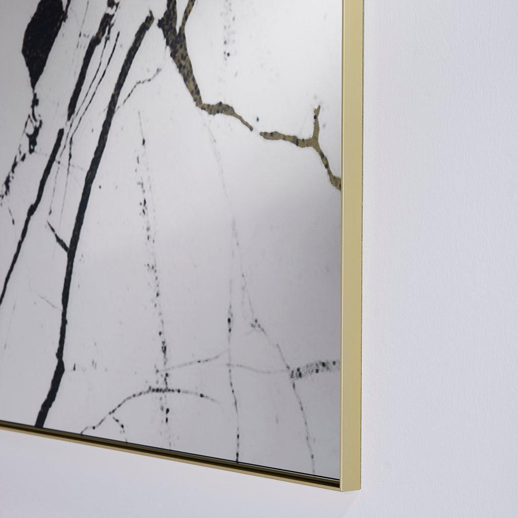 Miroir mural design moderne avec encadrement doré mat
