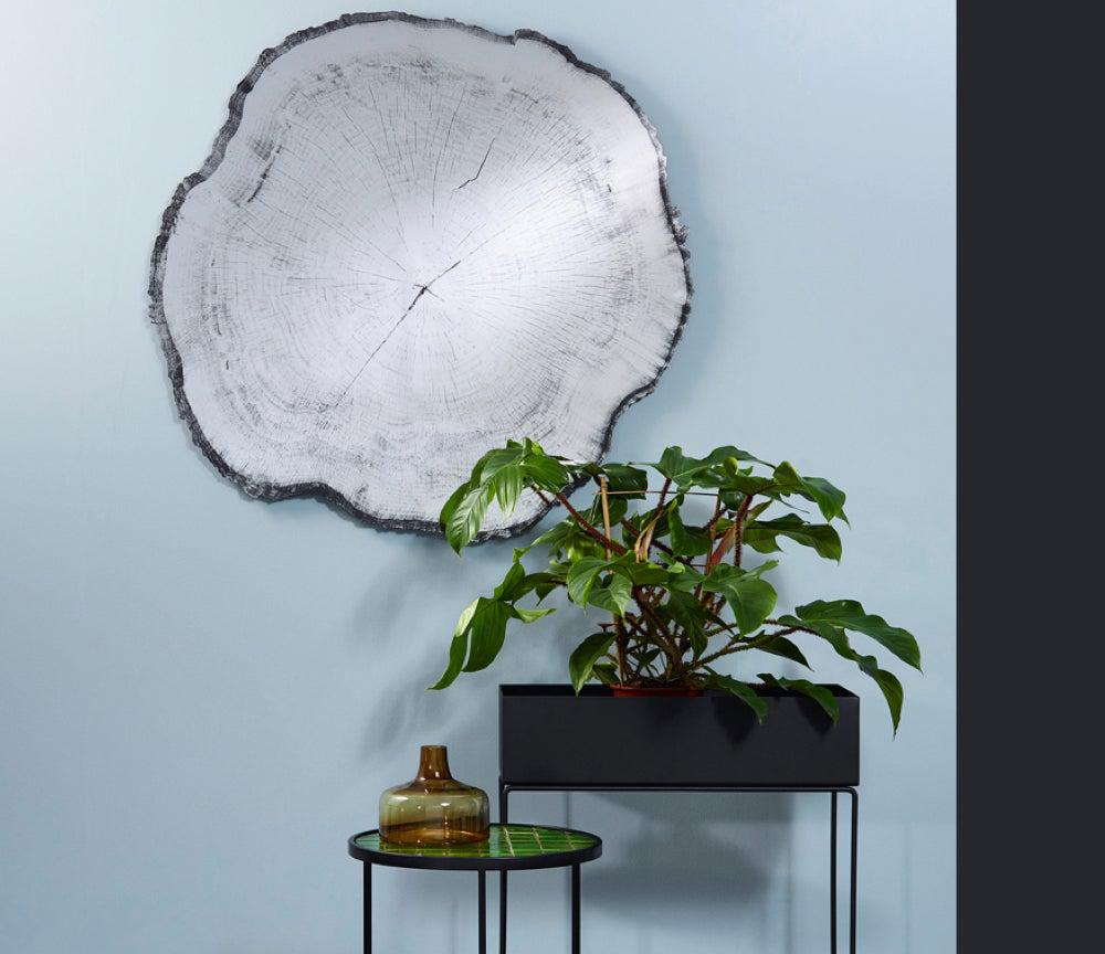 Miroir rond mural design Arbo en situation – salon – vue de face