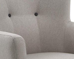 Fauteuil crapaud en tissu beige capiton noir et pieds bois - Souffle d'intérieur