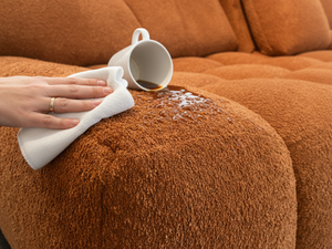 Zoom sur le tissu traité anti tâches d'un Canapé d’angle avec dossiers avance recule Terracotta - Souffle d'intérieur