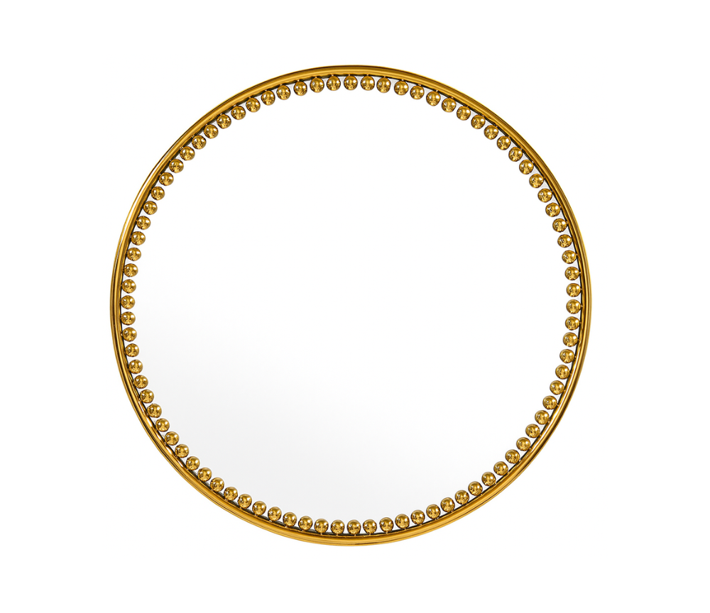 miroir rond doré sur un fond blanc