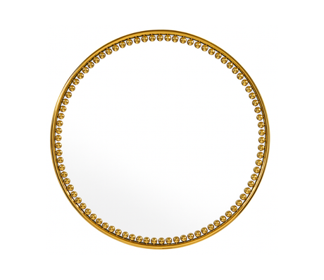 miroir rond doré sur un fond blanc