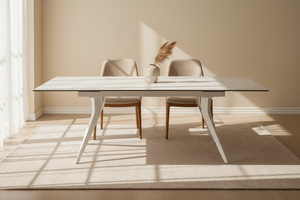 Table Thorus céramique extensible marbre blanc mat – vue de face, piétement acier blanc, salle à manger contemporaine