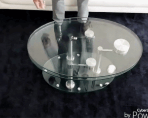 Table basse en verre design ovale pivotante
