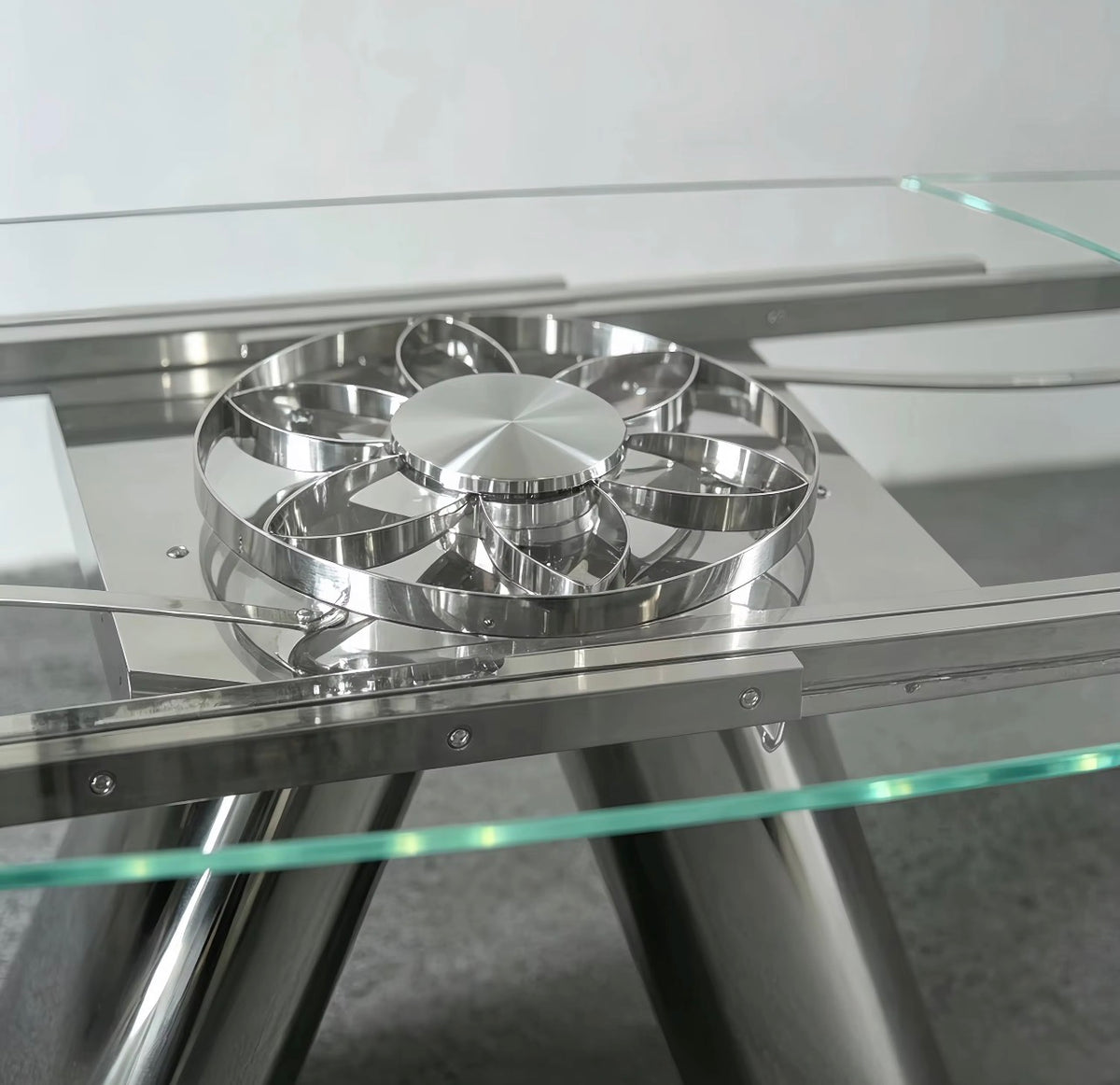 Mécanisme central en inox de la table en verre extensible Landy